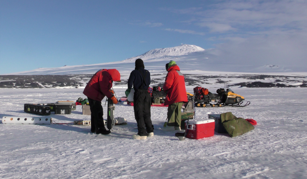 People loading a snow machine