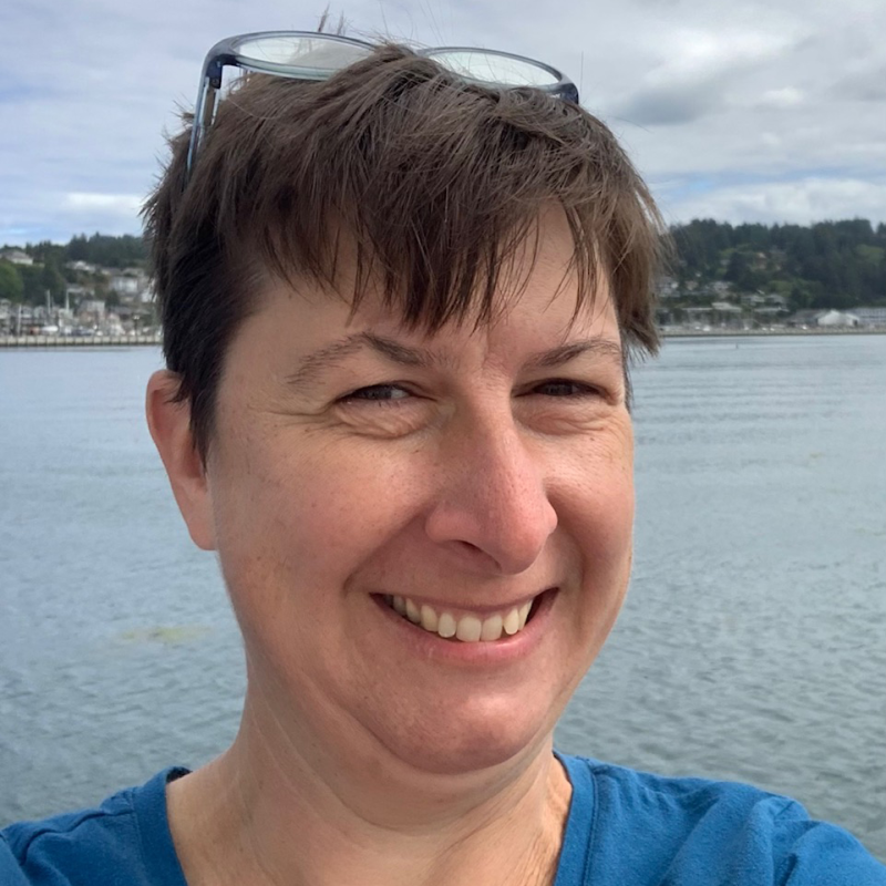 Beth Caissie in front of water