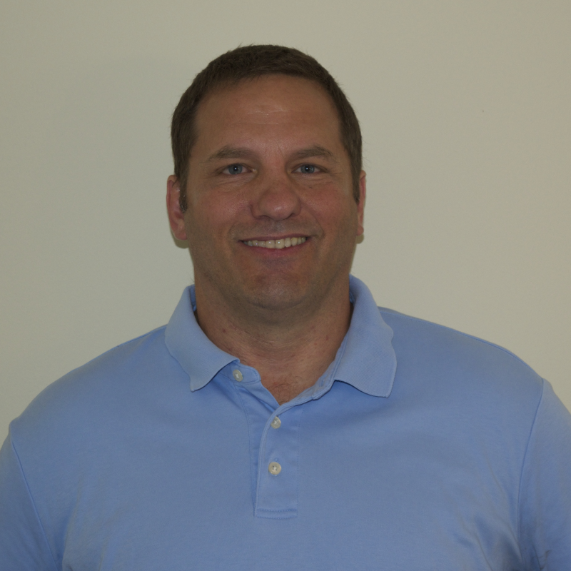 David Eisenberg in front of a beige background
