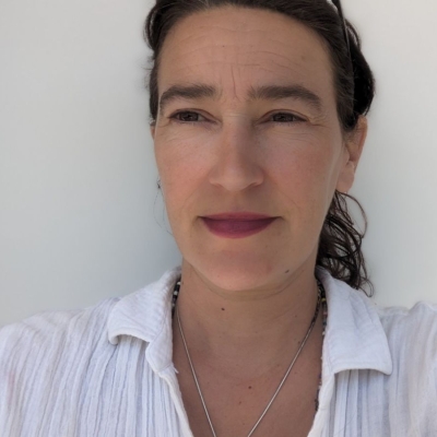 Joanna Rivers in front of a white background
