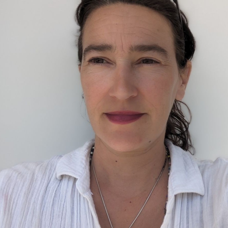 Joanna Rivers in front of a white background