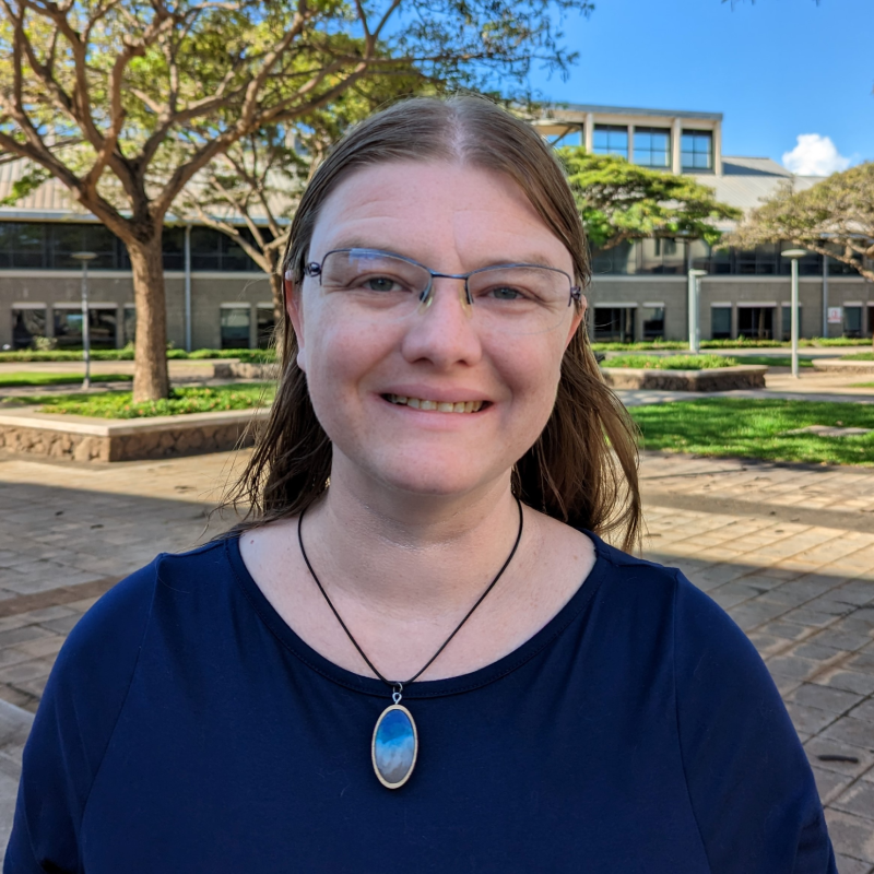 Sarah Glancy in front of a school