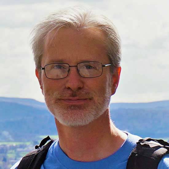 Robert Hollister in front of mountains