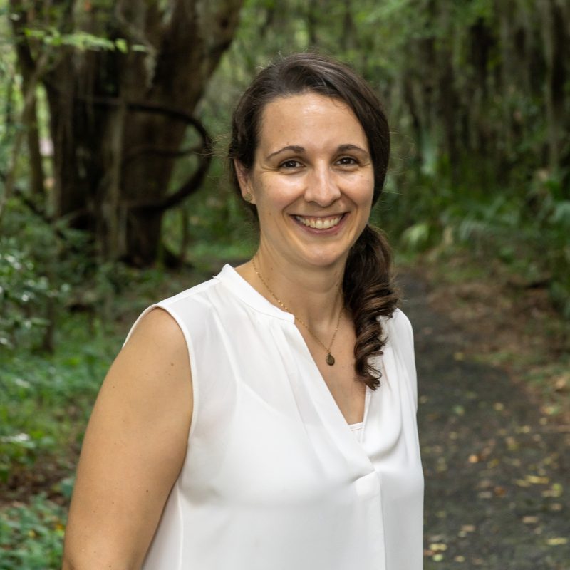 Elizabeth in front of trees