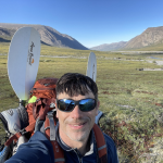 Eric outdoors wearing a backpack