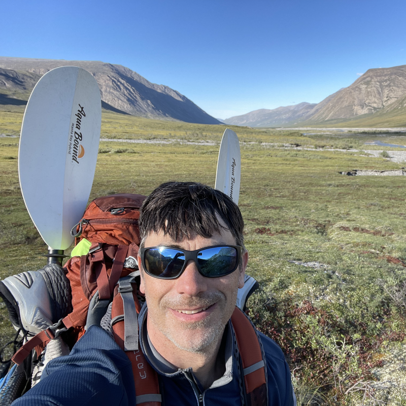 Eric outdoors wearing a backpack