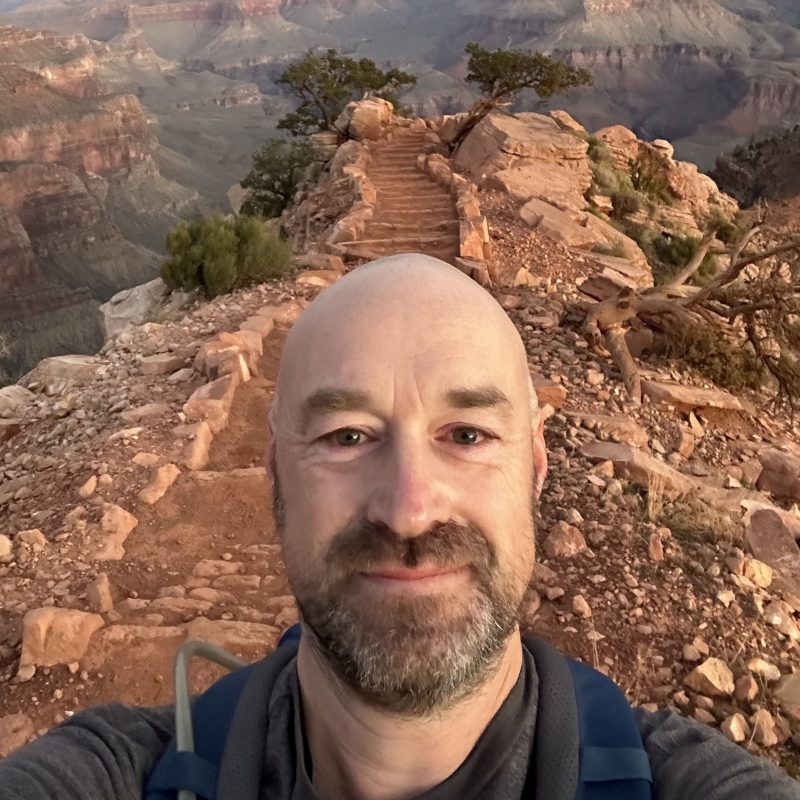 Filippo in front of cliffside stairs