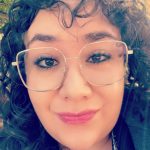 Close up of Jeannette's face wearing glasses