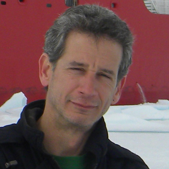 Kevin in front of a red plane