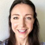 Laura in front of a white wall