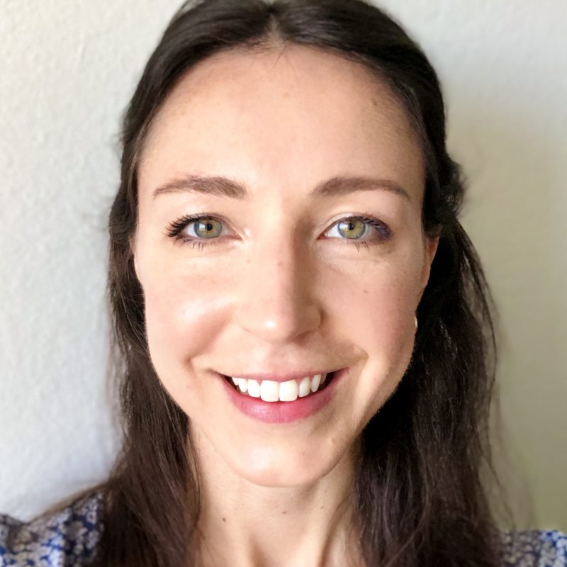 Laura in front of a white wall