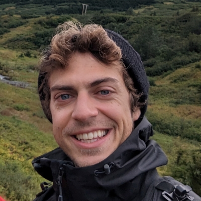 Matt in front of green hills