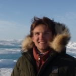 Christian in snow wearing a fluffy hooded jacket