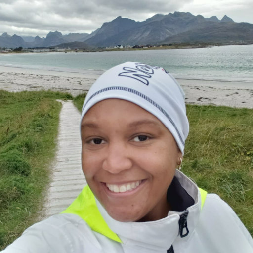 Kimberly smiling in front of the ocean