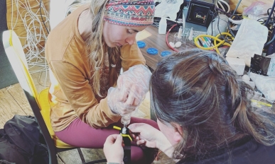 Macall and Holli filtering water samples