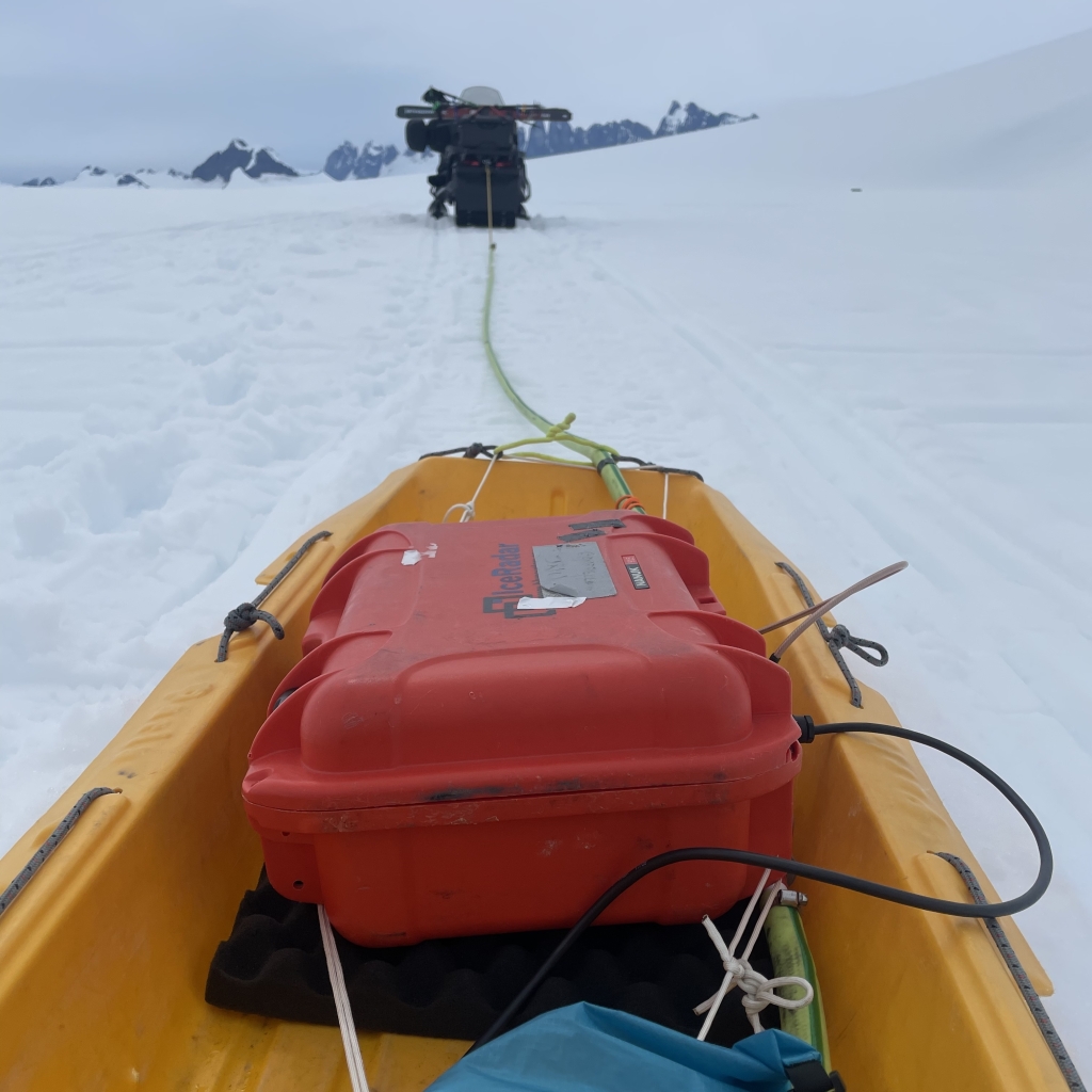 radar being pulled by a snowmobile