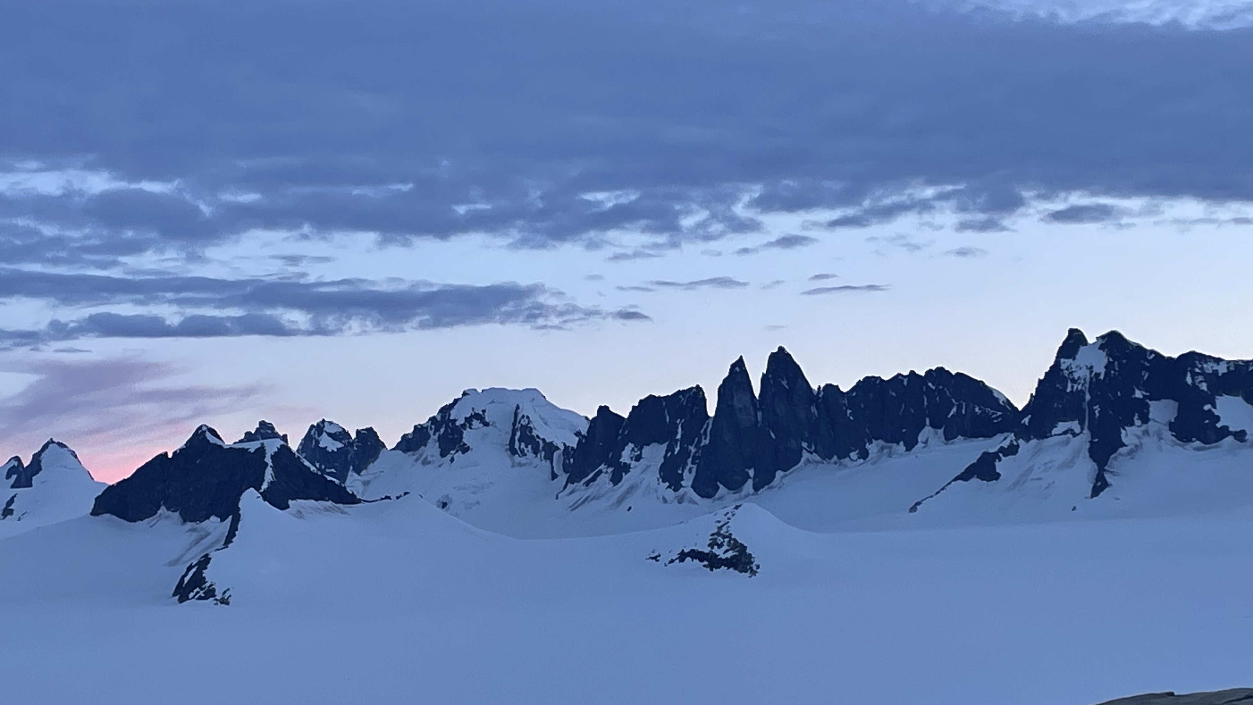 View of the Taku Towers, tall rocky peaks on the Juneau Icefield