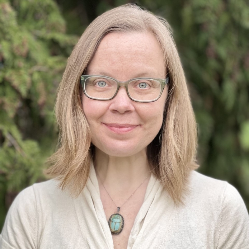 Carly smiling outdoors