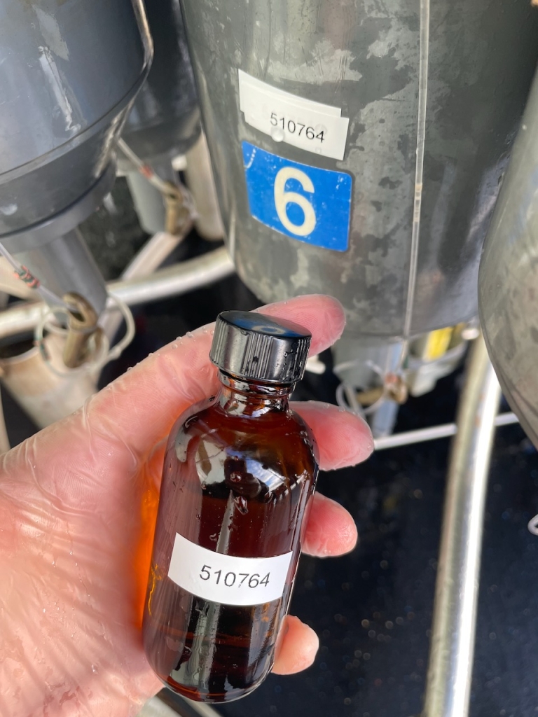 A bottle holding a water sample