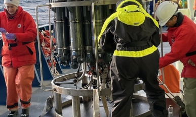 The team using the conductivity, temperature and depth tool on board the ship