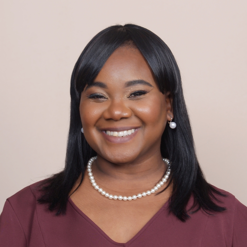 Precious in front of an off-white background