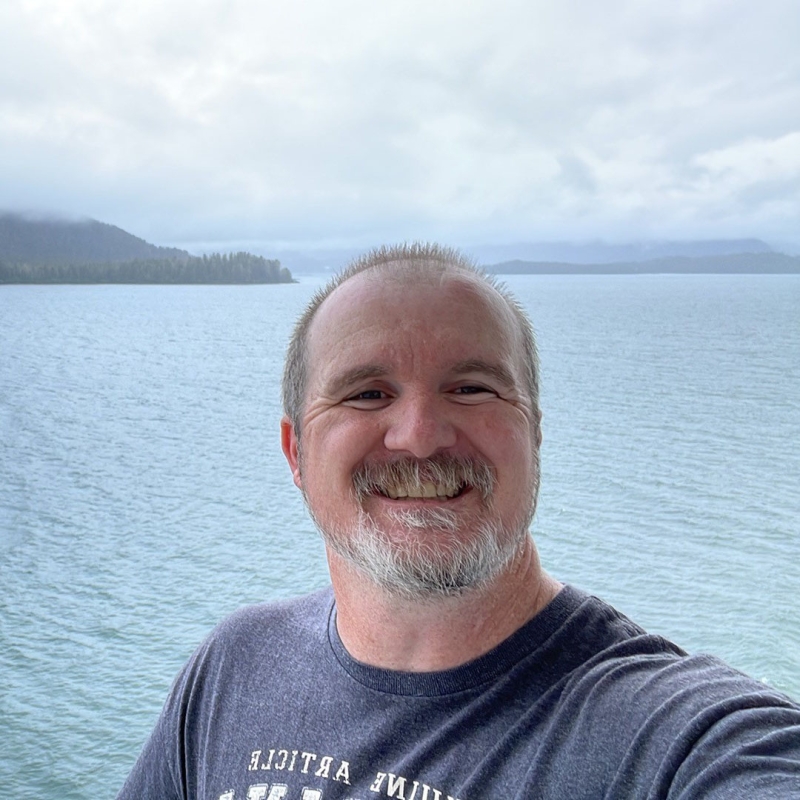 Bill in front of a body of water