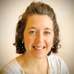 Elsa in front of an off-white background