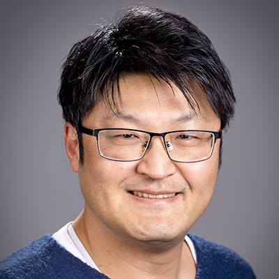 Naruki in front of a gray background