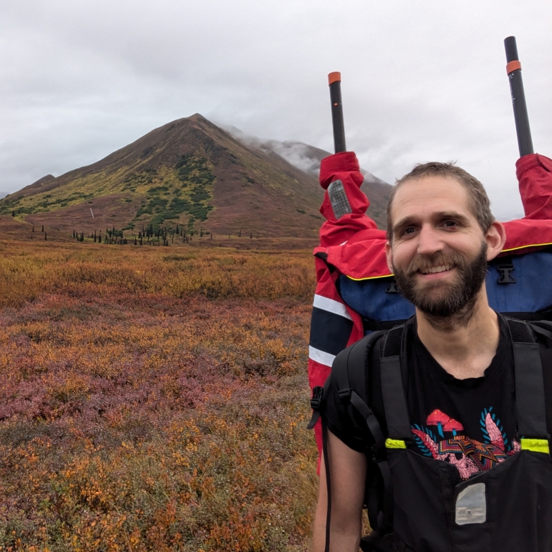 Will wearing a backpack in front of a mountain