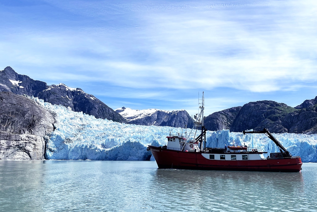  A ship in the water with mountains in the background
