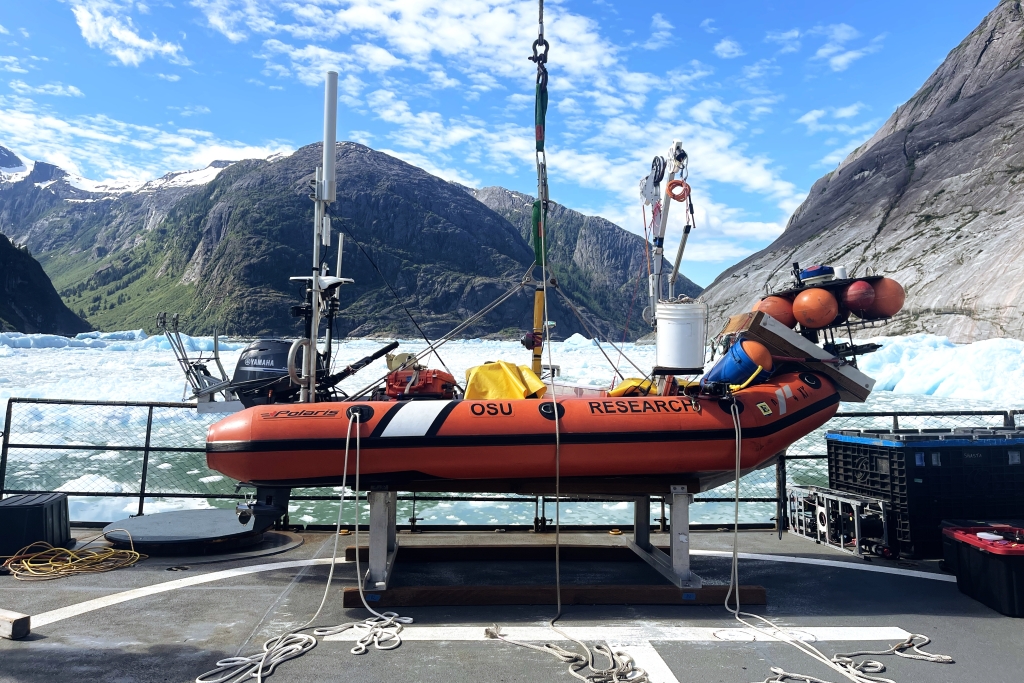 An inflatable boat sits at the side of the ship
