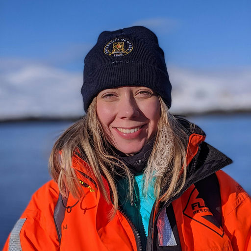 Joanna wearing an orange float suit