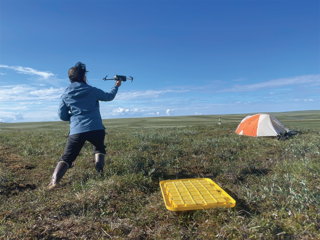 A person getting ready to launch a drone