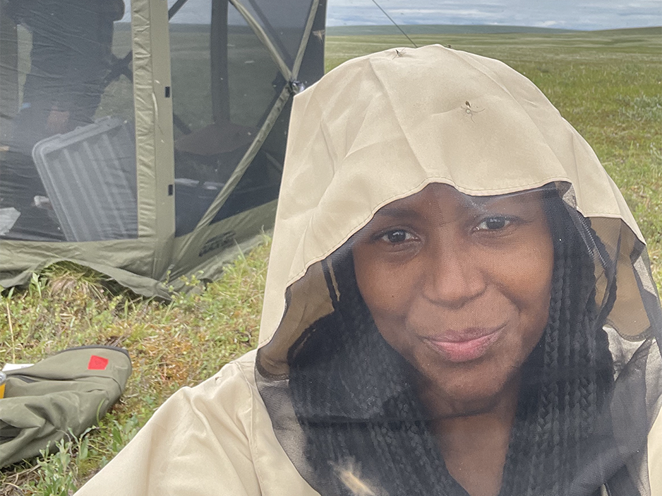 Tiffini standing in front of a tent