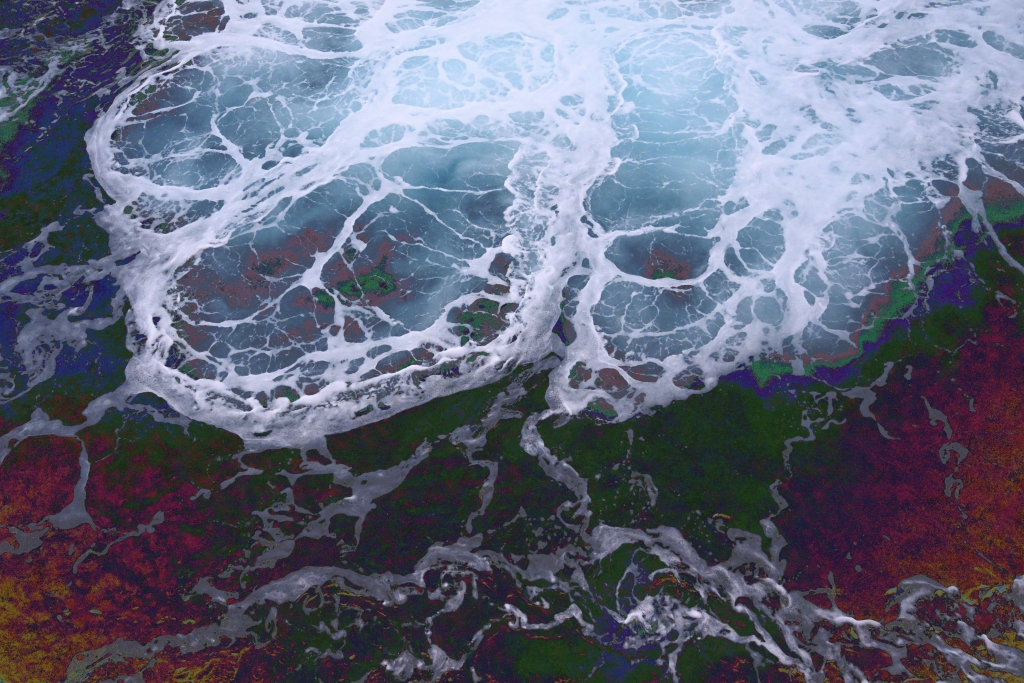 Brightly colored photo of the ocean from above.