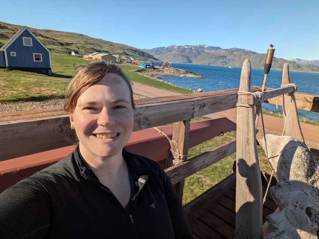 Heather Vingsness on the front porch of the Leif Eriksson hostel in Qassiarsuk, Greenland