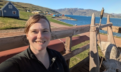 Heather Vingsness on the front porch of the Leif Eriksson hostel in Qassiarsuk, Greenland