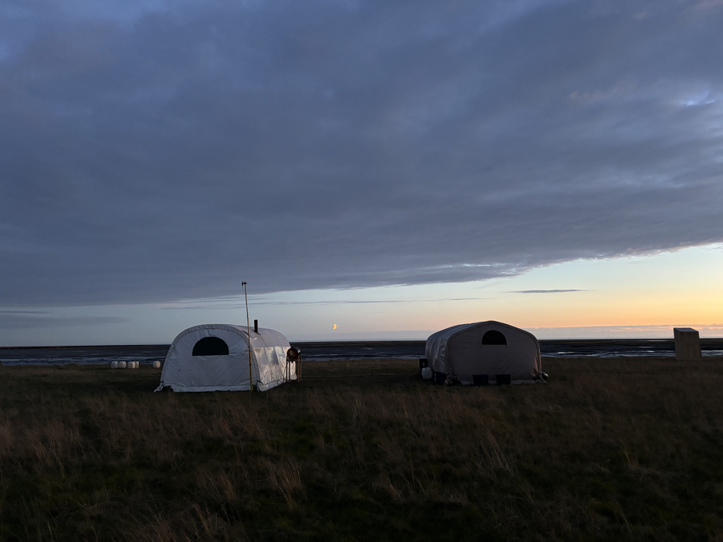 Camp at 2:21am on the summer solstice facing west. You can see the moon in the distance.