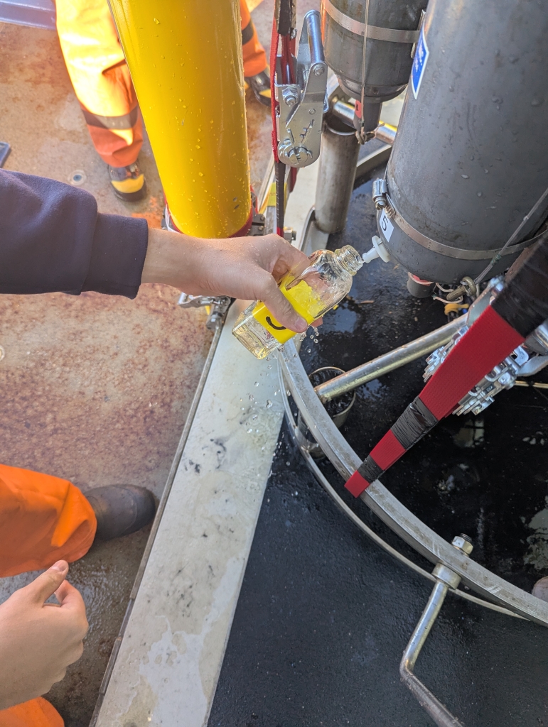 A bottle being filled from a tank